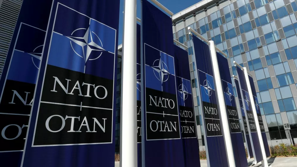 FILE PHOTO: Banners displaying the NATO logo are placed at the entrance of new NATO headquarters during the move to the new building, in Brussels, Belgium April 19, 2018. REUTERS/Yves Herman/File Photo