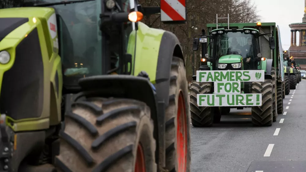 A sign is displayed on the front of a tractor, as German farmers take part in a protest against the cut of vehicle tax subsidies, in Berlin, Germany, December 18, 2023. REUTERS/Christian Mang