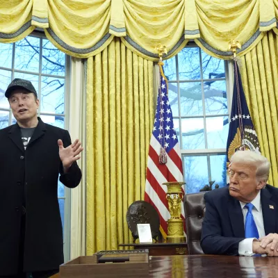 FILE - President Donald Trump listens as Elon Musk speaks in the Oval Office at the White House, Feb. 11, 2025, in Washington. (AP Photo/Alex Brandon, File)