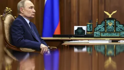 Russian President Vladimir Putin listens to Archpriest Alexander Tkachenko, Chairman of the Board of the Circle of Kindness Foundation and head of the commission for social partnership, trusteeship, and inclusive practices at the Russian Civic Chamber, at the Kremlin in Moscow, on Friday, May 30, 2025. (Alexander Kazakov, Sputnik, Kremlin Pool Photo via AP)