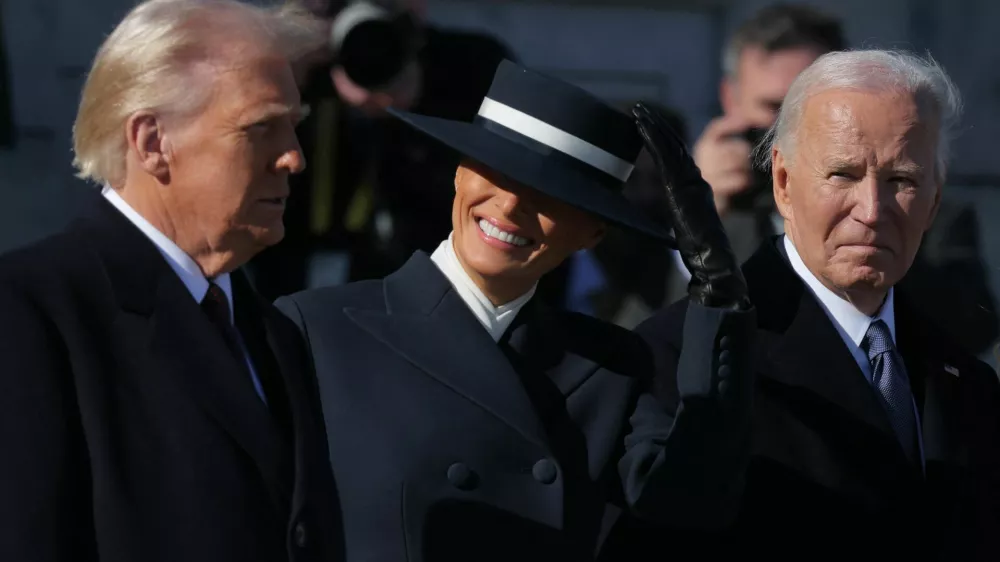 U.S. President Donald Trump stands with U.S. first lady Melania Trump, Former U.S. President Joe Biden and Former U.S. first lady Jill Biden (not pictured) on the inauguration day of Donald Trump's second presidential term, outside the U.S. Capitol building in Washington, U.S. January 20, 2025. REUTERS/Carlos Barria