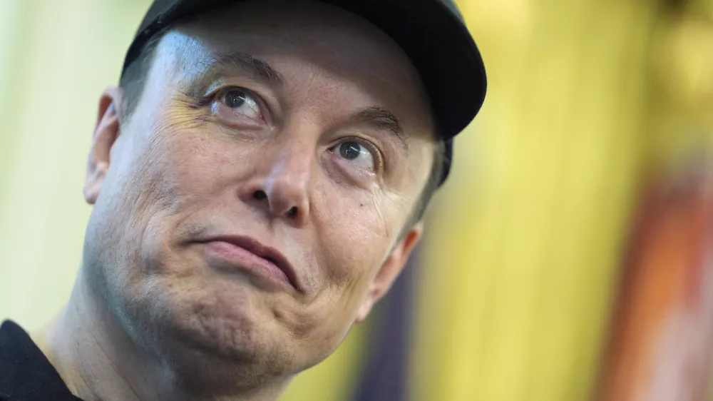 Elon Musk listens as President Donald Trump speaks during a news conference in the Oval Office of the White House, Friday, May 30, 2025, in Washington. (AP Photo/Evan Vucci)