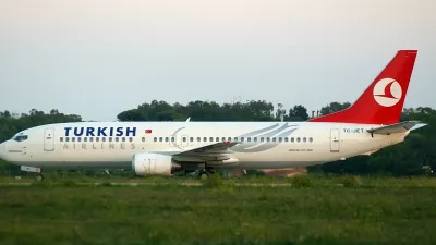 REFILE - ADDITIONAL INFORMATIONA hijacked Turkish Airlines plane sits on the runway at the Brindisi airport October 3, 2006. Two Turkish hijackers seeking to send a message to Pope Benedict seized a Turkish passenger plane flying from the Albanian capital Tirana to Istanbul on Tuesday and diverted it to Italy. REUTERS/Fabio Serino (ITALY)