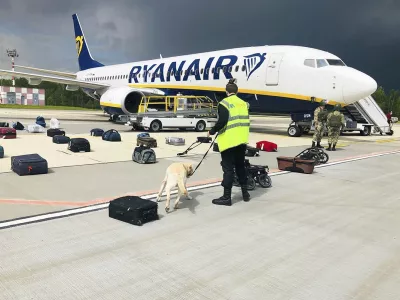 ﻿FILE - In this May 23, 2021, file photo provided by ONLINER.BY, security use a dog to check the luggage of passengers on the Ryanair jet that carried opposition figure Raman Pratasevich, traveling from Athens to Vilnius, Lithuania. The plane was diverted to Minsk, Belarus, after Belarusian flight controllers told the crew that there was a bomb threat against the plane. Pratasevich, who ran a channel on a messaging app used to organize demonstrations against authoritarian President Alexander Lukashenko, left his homeland in 2019 to try to escape the reach of the Belarusian KGB. Pratasevich was arrested upon landing in Minsk and faces 15 years in prison on charges of inciting disturbances. ď»żď»ż(ONLINER.BY via AP)