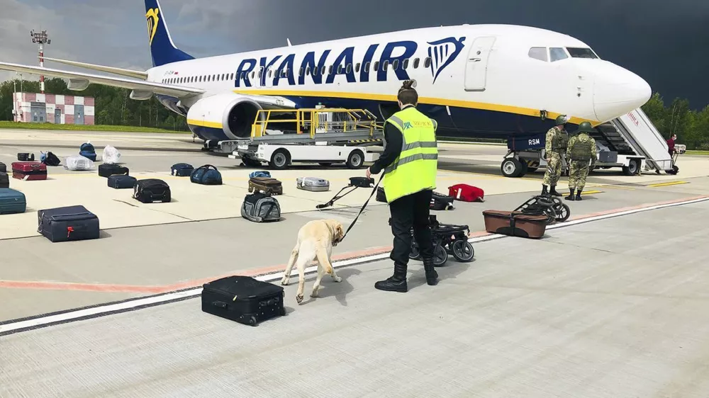 ﻿FILE - In this May 23, 2021, file photo provided by ONLINER.BY, security use a dog to check the luggage of passengers on the Ryanair jet that carried opposition figure Raman Pratasevich, traveling from Athens to Vilnius, Lithuania. The plane was diverted to Minsk, Belarus, after Belarusian flight controllers told the crew that there was a bomb threat against the plane. Pratasevich, who ran a channel on a messaging app used to organize demonstrations against authoritarian President Alexander Lukashenko, left his homeland in 2019 to try to escape the reach of the Belarusian KGB. Pratasevich was arrested upon landing in Minsk and faces 15 years in prison on charges of inciting disturbances. ď»żď»ż(ONLINER.BY via AP)