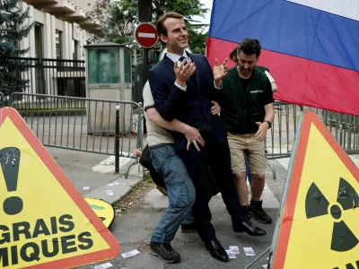 Greenpeace activists install a wax statue of French President Emmanuel Macron borrowed from the Grevin Museum without permission, to denounce what they call France's continued commercials ties with Russia despite the war in Ukraine, in front of the Russian Embassy in Paris, France, June 2, 2025. REUTERS/Benoit Tessier