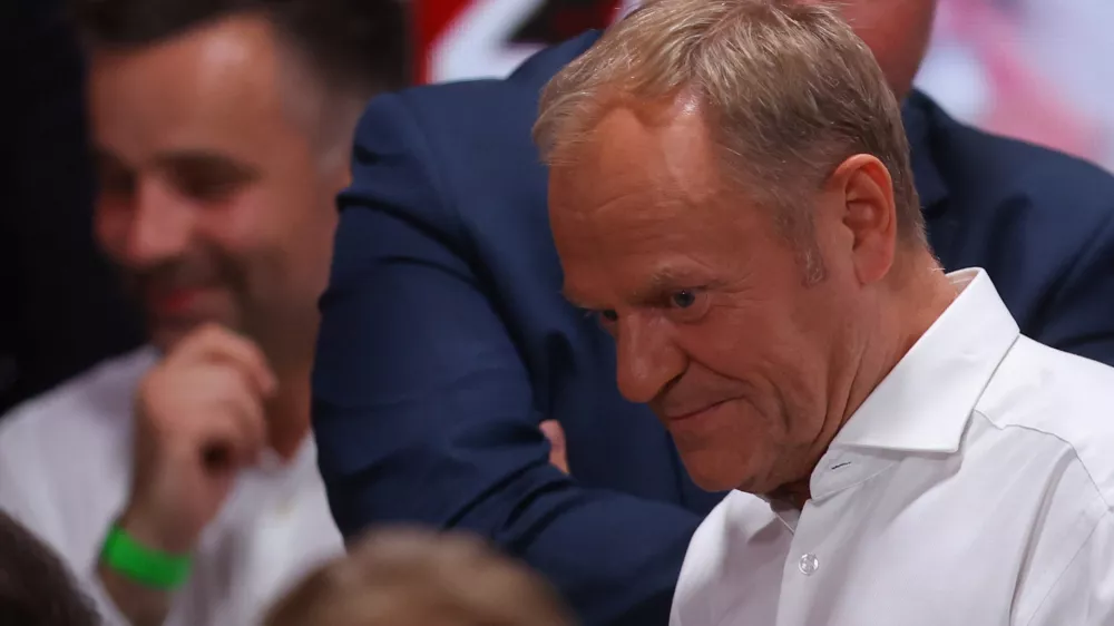 Civic Coalition's Polish Prime Minister Donald Tusk reacts after the exit poll announcement of the second round of presidential election in Warsaw, Poland, June 1, 2025. REUTERS/Kacper Pempel