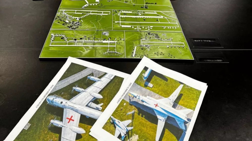Head of the Ukraine's Security Service Vasyl Maliuk looks at a map of an airfield, amid Russia's attack on Ukraine, in an unknown location in Ukraine, in this handout picture released June 1, 2025. Press service of the Security Service of Ukraine/Handout via REUTERS ATTENTION EDITORS - THIS IMAGE HAS BEEN SUPPLIED BY A THIRD PARTY.