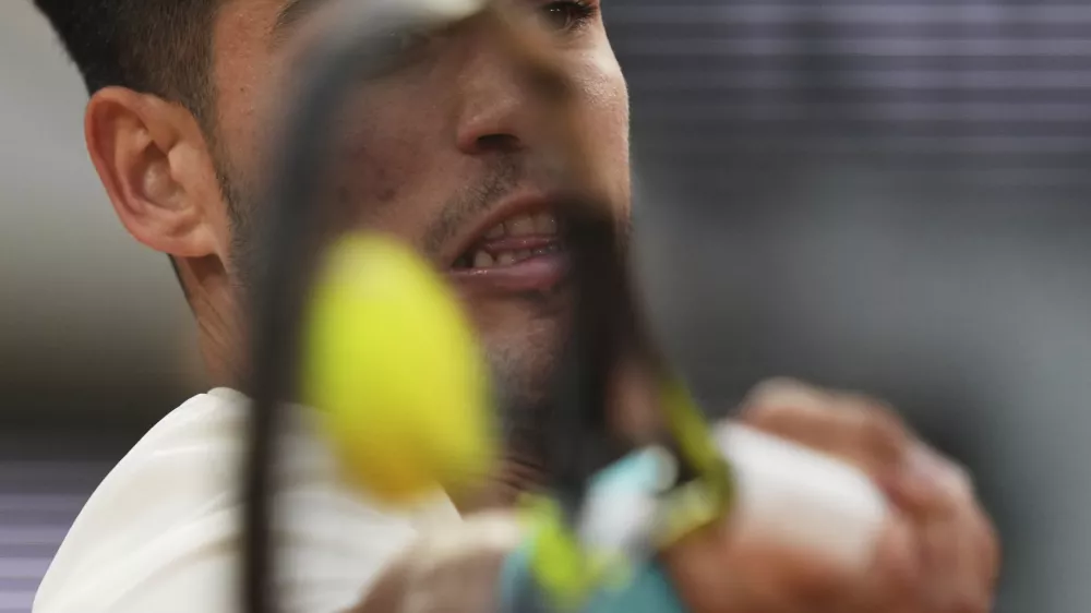 Spain's Carlos Alcaraz plays a shot against Tommy Paul of the U.S. during their quarterfinal match of the French Tennis Open at the Roland-Garros stadium in Paris, Tuesday, June 3, 2025. (AP Photo/Thibault Camus)