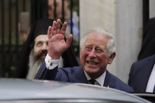 ﻿FILE - In this Thursday, May 10, 2018 file photo, Britain's Prince Charles, waves as he leaves a meeting with the head of Greece's Orthodox Church Archbishop Ieronymos, in Athens. Kensington Palace announced on Friday, May 18, 2018 Prince Charles will walk Meghan Markle down the aisle in her wedding to Prince Harry. (AP Photo/Petros Giannakouris)