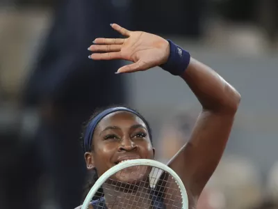 Coco Gauff of the U.S. celebrates as she won the semifinal match of the French Tennis Open against France's Lois Boisson at the Roland-Garros stadium in Paris, Thursday, June 5, 2025. (AP Photo/Lindsey Wasson)