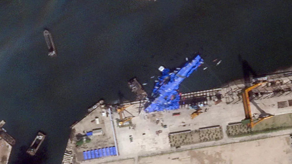 A satellite image shows a North Korean warship covered with a blue tarp after an accident that occurred during its launch at the shipyard in Chongjin, North Korea, May 23, 2025. 2025 Planet Labs PBC/Handout via REUTERS THIS IMAGE HAS BEEN SUPPLIED BY A THIRD PARTY. MANDATORY CREDIT