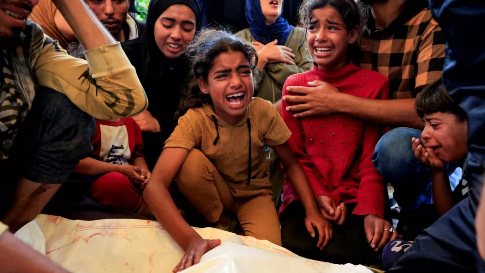 Mourners react during the funeral of a Palestinian killed, in what the Gaza health ministry says was Israeli fire near a distribution center in Rafah, at Nasser hospital in Khan Younis, in the southern Gaza Strip, June 8, 2025. REUTERS/Hatem Khaled   TPX IMAGES OF THE DAY