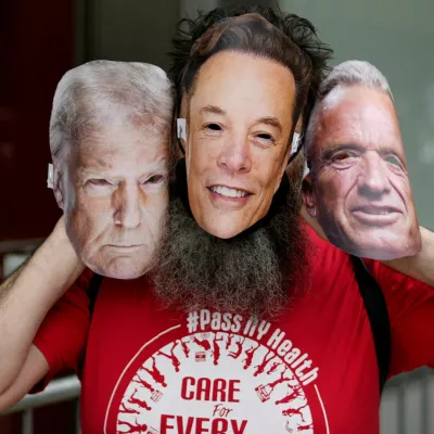 A person takes part in a protest against Tesla and its CEO Elon Musk outside a Tesla store in New York City, U.S. June 7, 2025. REUTERS/Eduardo Munoz