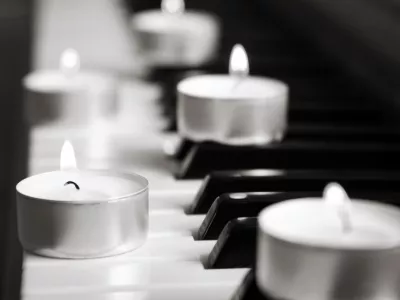 burning candles and pianoforte, monochrome image