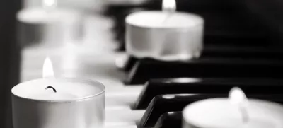 burning candles and pianoforte, monochrome image