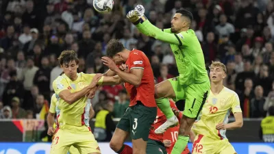 Portugal goalkeeper Diogo Costa punches out the ball during the Nations League final soccer match between Portugal and Spain at the Allianz Arena in Munich, Germany, Sunday, June 8, 2025. (AP Photo/Matthias Schrader)