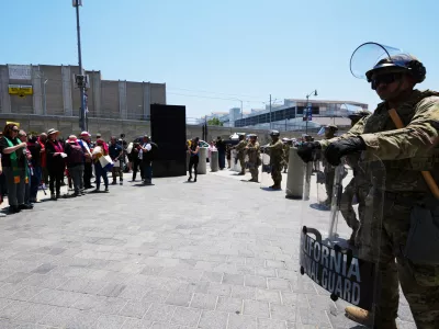 U.S. National Guard stand by as protesters gather to denounce ICE, U.S Immigration and Customs Enforcement, operations Tuesday, June 10, 2025, in Los Angeles. (AP Photo Damian Dovarganes)