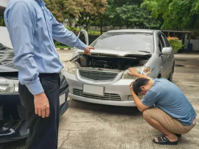 2MFE1GJ Man Upset and Sit down Motorist In Crash For Crash Insurance Fraud Getting Out Of Car