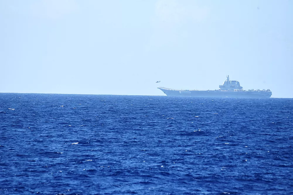 FILE PHOTO: A helicopter takes off from China's Shandong aircraft carrier, over Pacific Ocean waters, south of Okinawa prefecture, Japan, in this handout photo taken April 15, 2023 and released by the Joint Staff Office of the Defense Ministry of Japan April 17, 2023. Joint Staff Office of the Defense Ministry of Japan/HANDOUT via REUTERS ATTENTION EDITORS - THIS IMAGE WAS PROVIDED BY A THIRD PARTY. MANDATORY CREDIT./File Photo