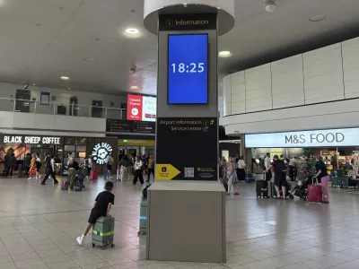 The time of 18:25 is displayed on an information sign when the Air India jet that crashed in Ahmedabad, India, was due to land at Gatwick Airport near London, Thursday, June 12, 2025. (AP Photo/Kin Cheung)