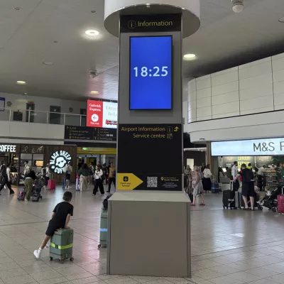 The time of 18:25 is displayed on an information sign when the Air India jet that crashed in Ahmedabad, India, was due to land at Gatwick Airport near London, Thursday, June 12, 2025. (AP Photo/Kin Cheung)