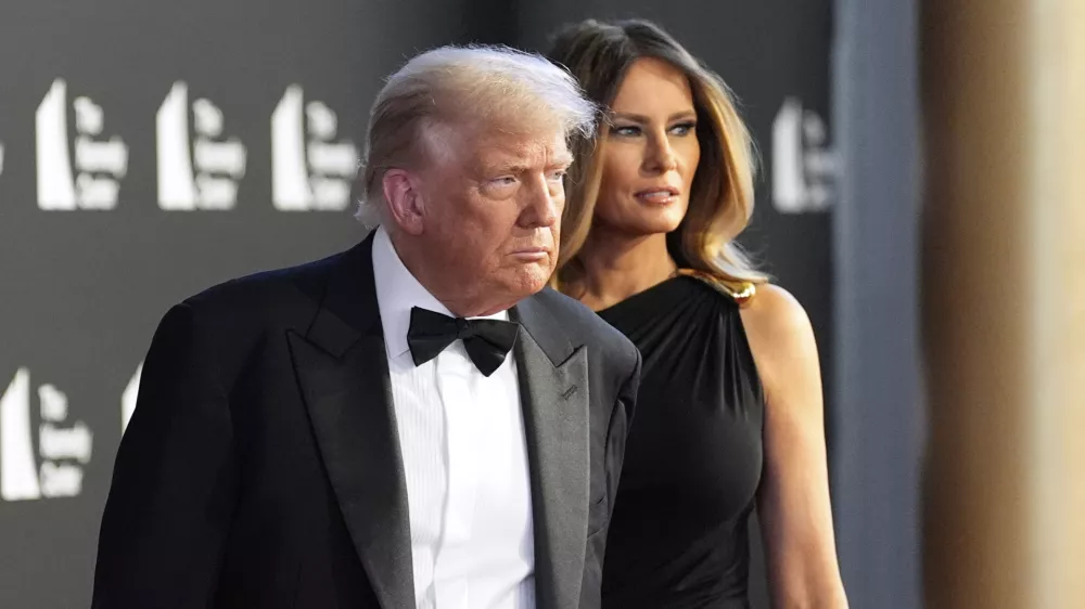 President Donald Trump and first lady Melania Trump arrive to view opening night of "Les Miserables," at the Kennedy Center, Wednesday, June 11, 2025, in Washington. (AP Photo/Alex Brandon)