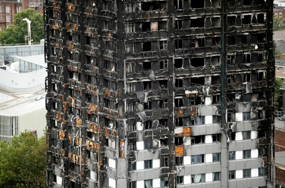 FILE PHOTO: A general view shows the Grenfell Tower, which was destroyed in a fatal fire, in London, Britain July 15, 2017. REUTERS/Tolga Akmen/File Photo