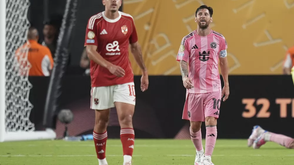 Inter Miami's Lionel Messi, right, and Al Ahly's Nejc Gradisar leaves the pitch at the end of the Club World Cup group A soccer match between Al Ahly and Inter Miami in Miami, Fla., Saturday, June 14, 2025. (AP Photo/Rebecca Blackwell)