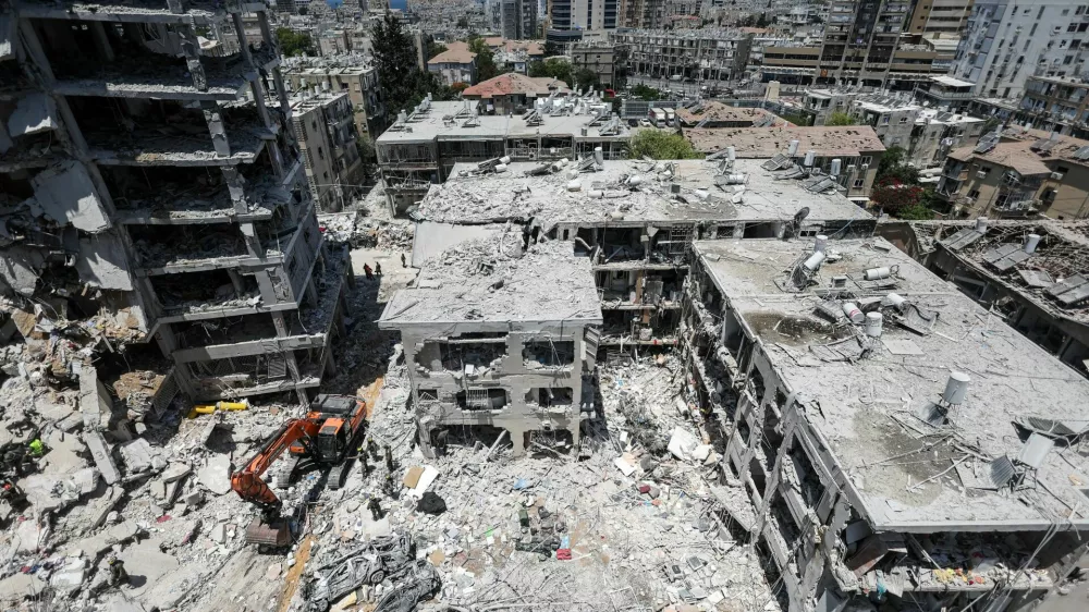 Damaged buildings are seen following a missile attack from Iran on Israel, in Bat Yam, Israel, June 15, 2025. REUTERS/Ronen Zvulun    TPX IMAGES OF THE DAY