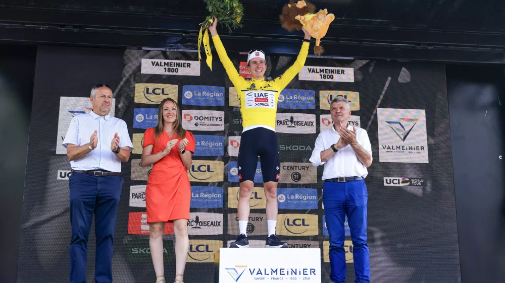 14 June 2025, France, Mont-Cenis: Slovenian cyclist Tadej Pogacar of UAE Team Emirates XRG celebrates on the podium after winning the 8th and final stage of the 77th edition of the Criterium du Dauphine cycling race, 133.3 km from Val-d'Arc-Val-Cenis to Plateau du Mont Cenis. Photo: Stefano Cavasino/LiveMedia-IPA/ZUMA Press Wire/dpa