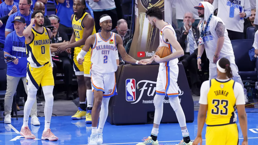 Jun 16, 2025; Oklahoma City, Oklahoma, USA; Oklahoma City Thunder guard Shai Gilgeous-Alexander (2) and forward Chet Holmgren (7) celebrate during the fourth quarter against the Indiana Pacers in game five of the 2025 NBA Finals at Paycom Center. Mandatory Credit: Alonzo Adams-Imagn Images