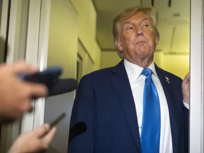 President Donald Trump speaks with reporters while flying aboard Air Force One en route from Calgary, Canada to Joint Base Andrews, Md., late Monday, June 16, 2025. (AP Photo/Mark Schiefelbein)