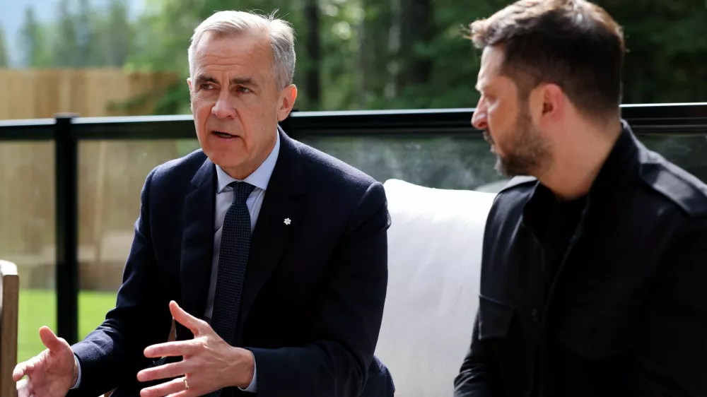 Canadian Prime Minister Mark Carney and Ukrainian President Volodymyr Zelenskiy attend a meeting during the G7 Leaders' Summit in Kananaskis, in Alberta, Canada, June 17, 2025. REUTERS/Suzanne Plunkett/Pool