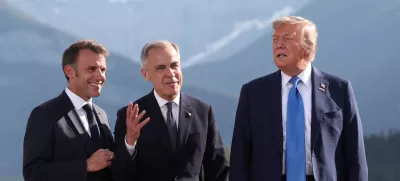 French President Emmanuel Macron, Canada's Prime Minister Mark Carney and U.S. President Donald Trump attend a family photo session during the G7 Summit, in Kananaskis, Alberta, Canada, June 16, 2025. REUTERS/Suzanne Plunkett/Pool