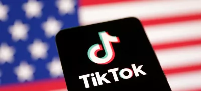 FILE PHOTO: U.S. flag and TikTok logo are seen in this illustration taken January 8, 2025. REUTERS/Dado Ruvic/Illustration/File Photo