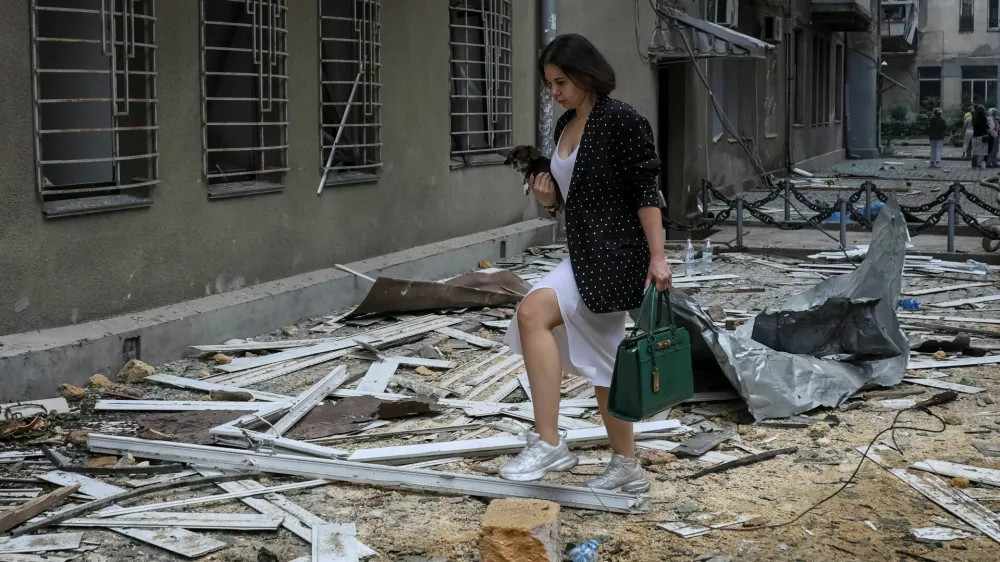 A resident walks at the site of a Russian drone strike, amid Russia's attack on Ukraine, in Odesa, Ukraine June 20, 2025. REUTERS/Nina Liashonok