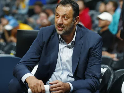 FILE -Sacramento Kings general manager Vlade Divac looks on from the bench as his team warms up before facing the Denver Nuggets in an NBA basketball game, Oct. 21, 2017, in Denver. (AP Photo/David Zalubowski, File)