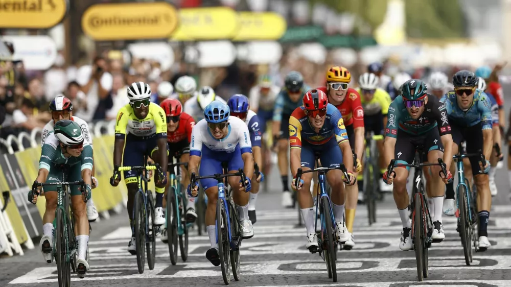 Cycling - Tour de France - Stage 21 - Saint-Quentin-En-Yvelines to Paris Champs-Elysees - France - July 23, 2023 Bora&ndash;Hansgrohe's Jordi Meeus crosses the finish line to win stage 21 alongside Alpecin&ndash;Deceuninck's Jasper Philipsen, Team Jayco&ndash;AlUla's Dylan Groenewegen and Lidl&ndash;Trek's Mads Pedersen REUTERS/Stephane Mahe
