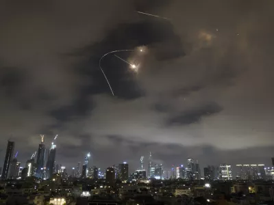 Israeli air defense system fires to intercept missiles during an Iranian attack over Tel Aviv, Israel, Saturday, June 21, 2025. (AP Photo/Leo Correa)