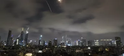 Israeli air defense system fires to intercept missiles during an Iranian attack over Tel Aviv, Israel, Saturday, June 21, 2025. (AP Photo/Leo Correa)