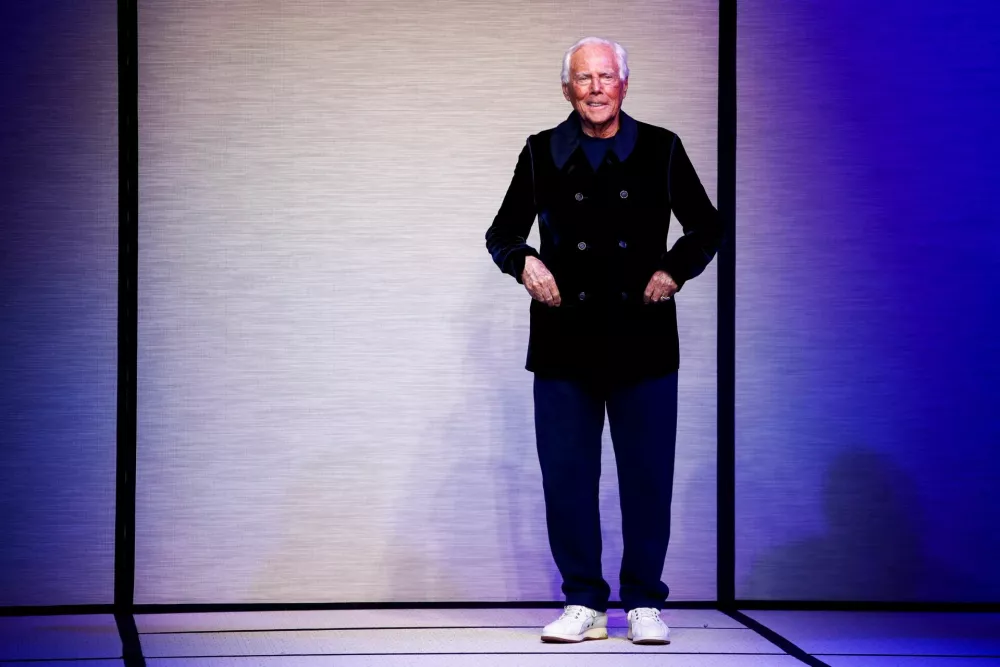 FILE PHOTO: Designer Giorgio Armani appears at the end of the Giorgio Armani Fall-Winter 2025/2026 menswear collection during Milan Fashion Week, in Milan, Italy, January 20, 2025. REUTERS/Alessandro Garofalo/File Photo