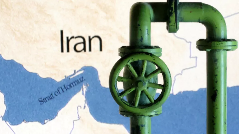 A map showing the Strait of Hormuz and Iran is seen behind a 3D printed oil pipeline in this illustration taken June 22, 2025. REUTERS/Dado Ruvic/Illustration