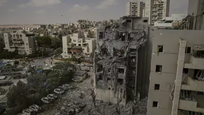 Israeli soldiers and rescue team work amid the rubble of residential buildings destroyed by an Iranian missile strike that killed several people, in Beersheba, Israel, on Tuesday, June 24, 2025. (AP Photo/Leo Correa)