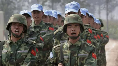 Chinese soldiers from an engineering unit practice at an army camp in Qinyang in Henan province September 15, 2007. The soldiers are a part of a 315-member multi-functional unit that will go for a United Nations peacekeeping mission in the Darfur region of Sudan in the near future. The peacekeeping mission will build and maintain barracks, roads, helipads and bridges, the army said. REUTERS/Reinhard Krause (CHINA)