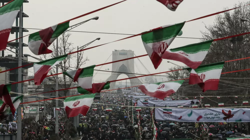 ﻿11 February 2019, Iran, Tehran: People gather in front of the Azadi Tower at the Azadi Square during a ceremony marking the 40th anniversary of the Iranian Islamic Revolution. Photo: Saeid Zareian/dpa