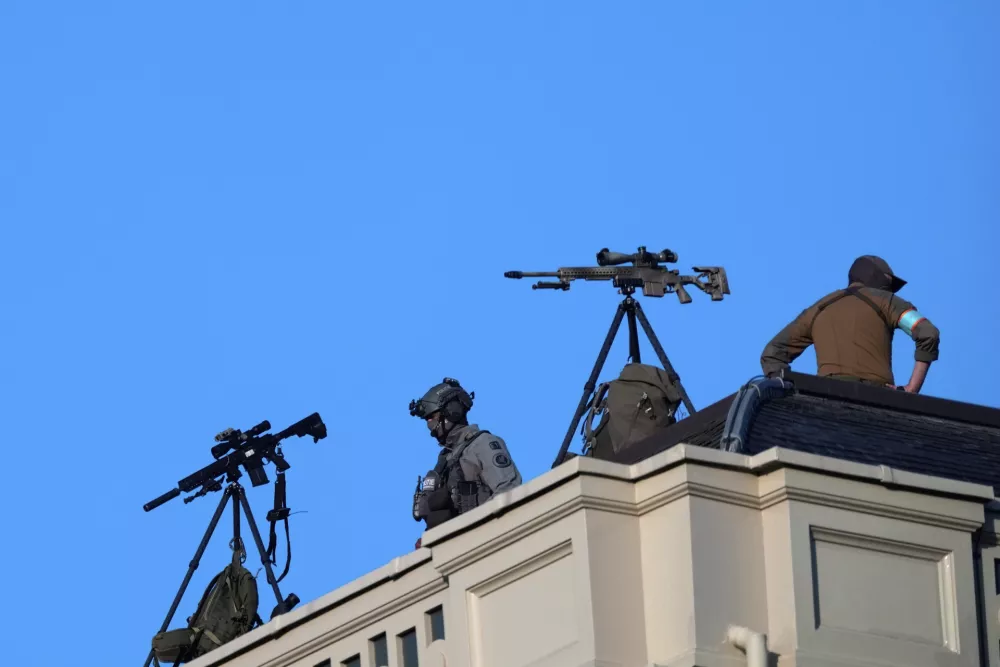 Special police forces watch as President Donald Trump arrives for a formal dinner at the Paleis Huis ten Bosch ahead of the NATO summit in The Hague, Netherlands, Tuesday, June 24, 2025. (AP Photo/Alex Brandon)