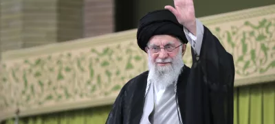 In this photo released by an official website of the office of the Iranian supreme leader, Supreme Leader Ayatollah Ali Khamenei waves to the crowd during a meeting with school and university students, in Tehran, Iran, Saturday, Nov. 2, 2024. (Office of the Iranian Supreme Leader via AP)