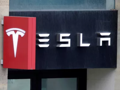 FILE PHOTO: The logo of Tesla is seen on a store in Paris, France, October 30, 2020. REUTERS/Charles Platiau/File Photo