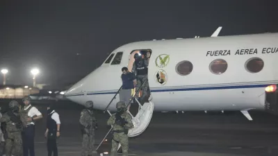 Escorted by soldiers and policemen, Adolfo "Fito" Macias, the leader of the Choneros gang, arrives in Guayaquil, Ecuador, Wednesday, June 25, 2025. (AP Photo/Joffre Flores)